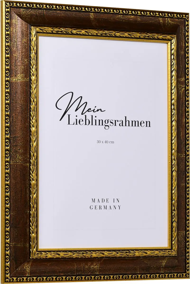 Seitenansicht eines braunen, pompÃ¶sen Bilderrahmens mit detailreichen Barockapplikationen