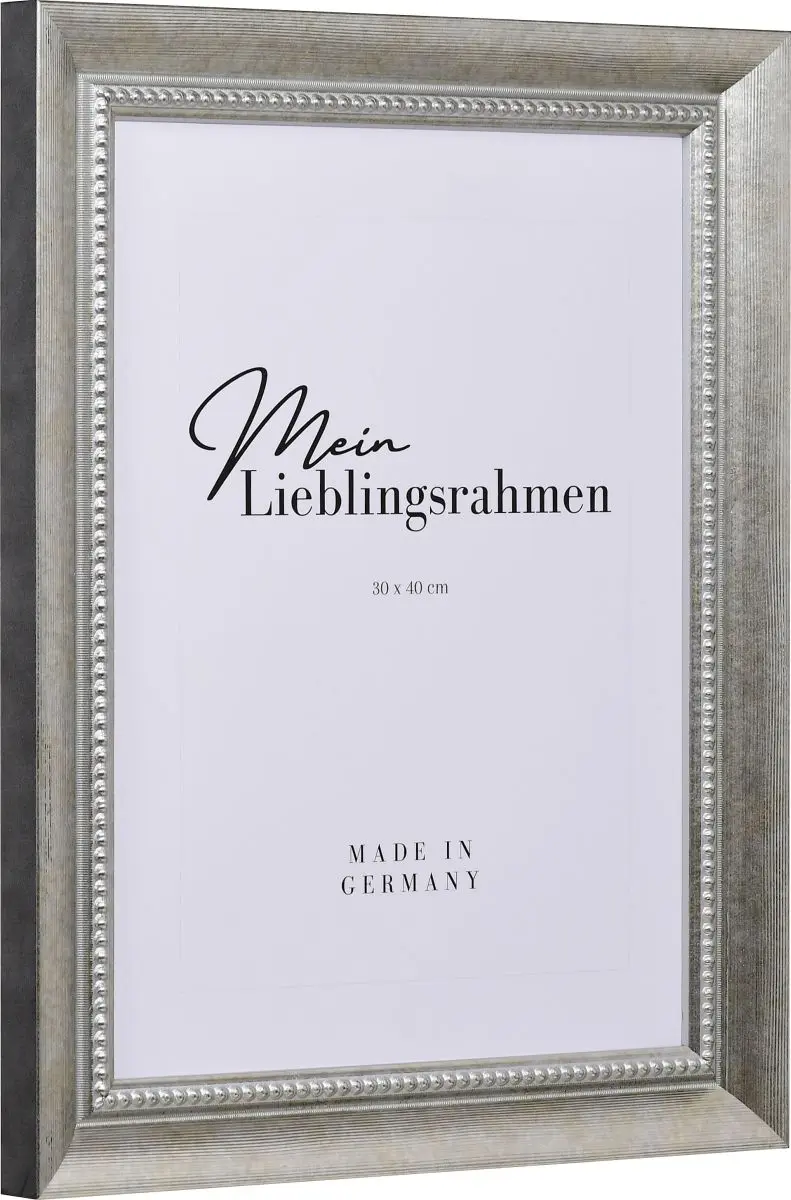 Seitenansicht eines silbernen Bilderrahmens mit einer durch ein PrÃ¤gerad aufgebrachten OberflÃ¤che und einem Perlstab