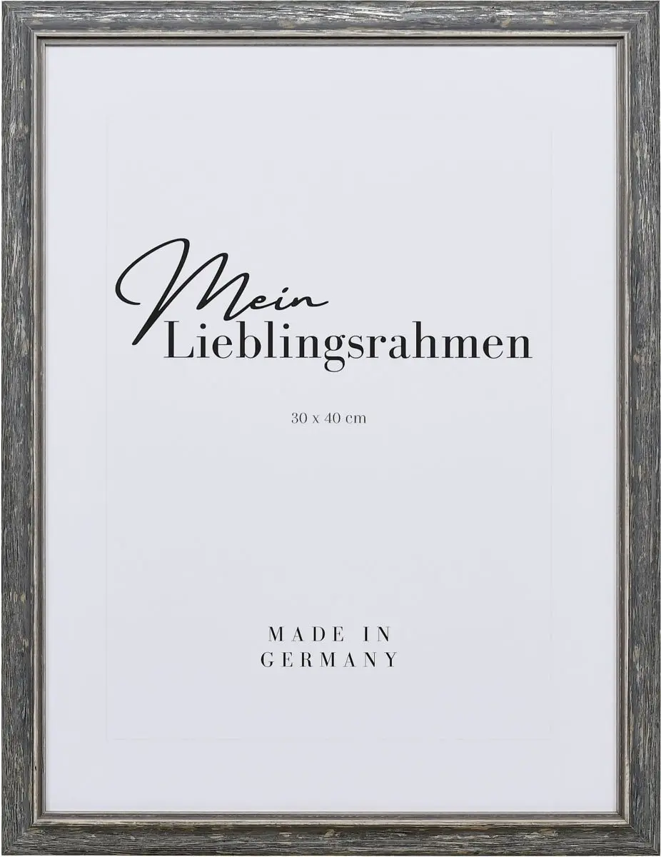 Frontaanzicht van een zwarte houten lijst met een subtiel gebogen massief houten profiel en een afgezette binnenrand in landelijke stijl