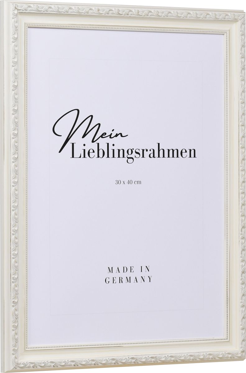 Seitenansicht eines verspielten, weissen, barocken Holzrahmens mit floralen Ornamenten und einen zarten Perlstab