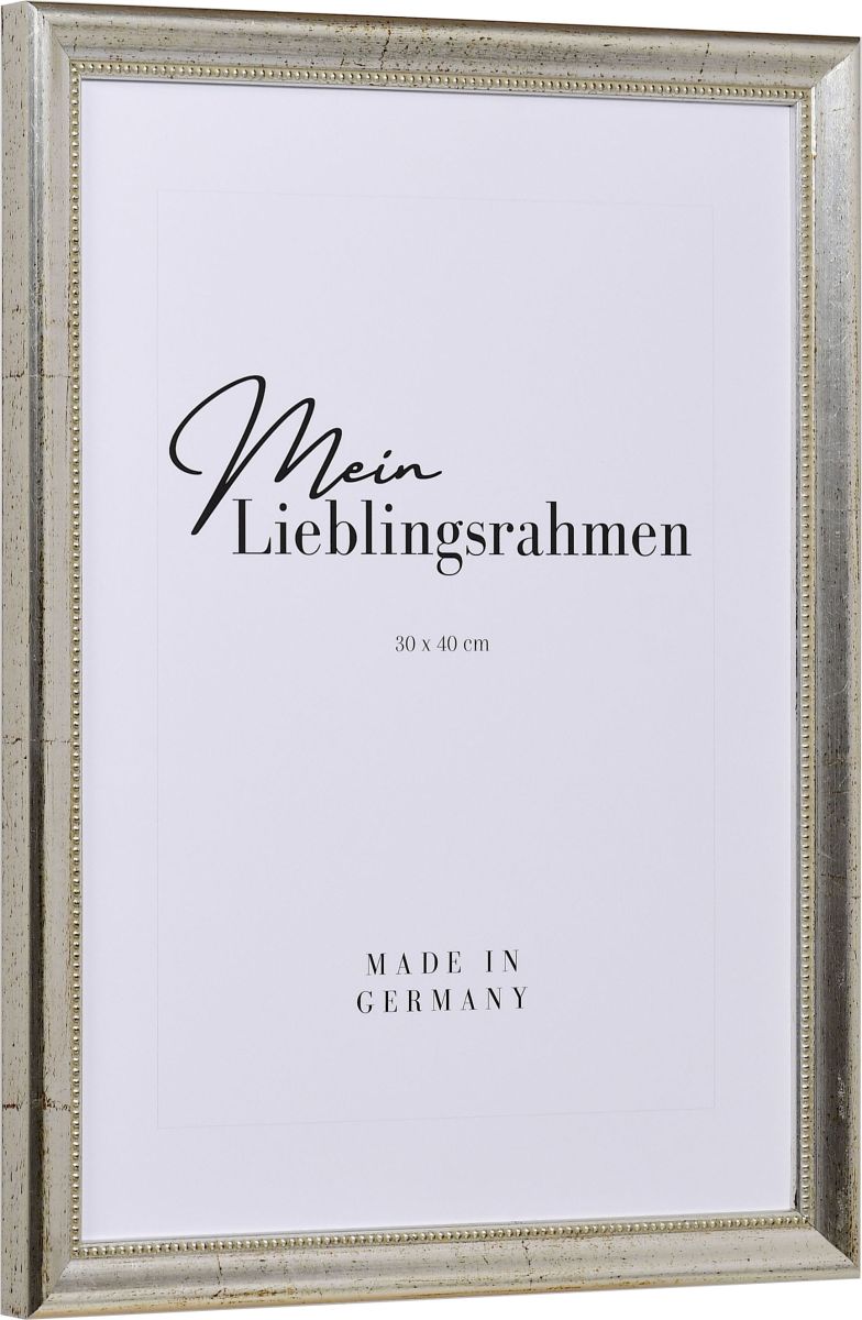 Seitenansicht eines silbernen Holzrahmens mit von Hand aufgebÃ¼rsteten Schlagmetall und einem Perlstab an der Innenkante